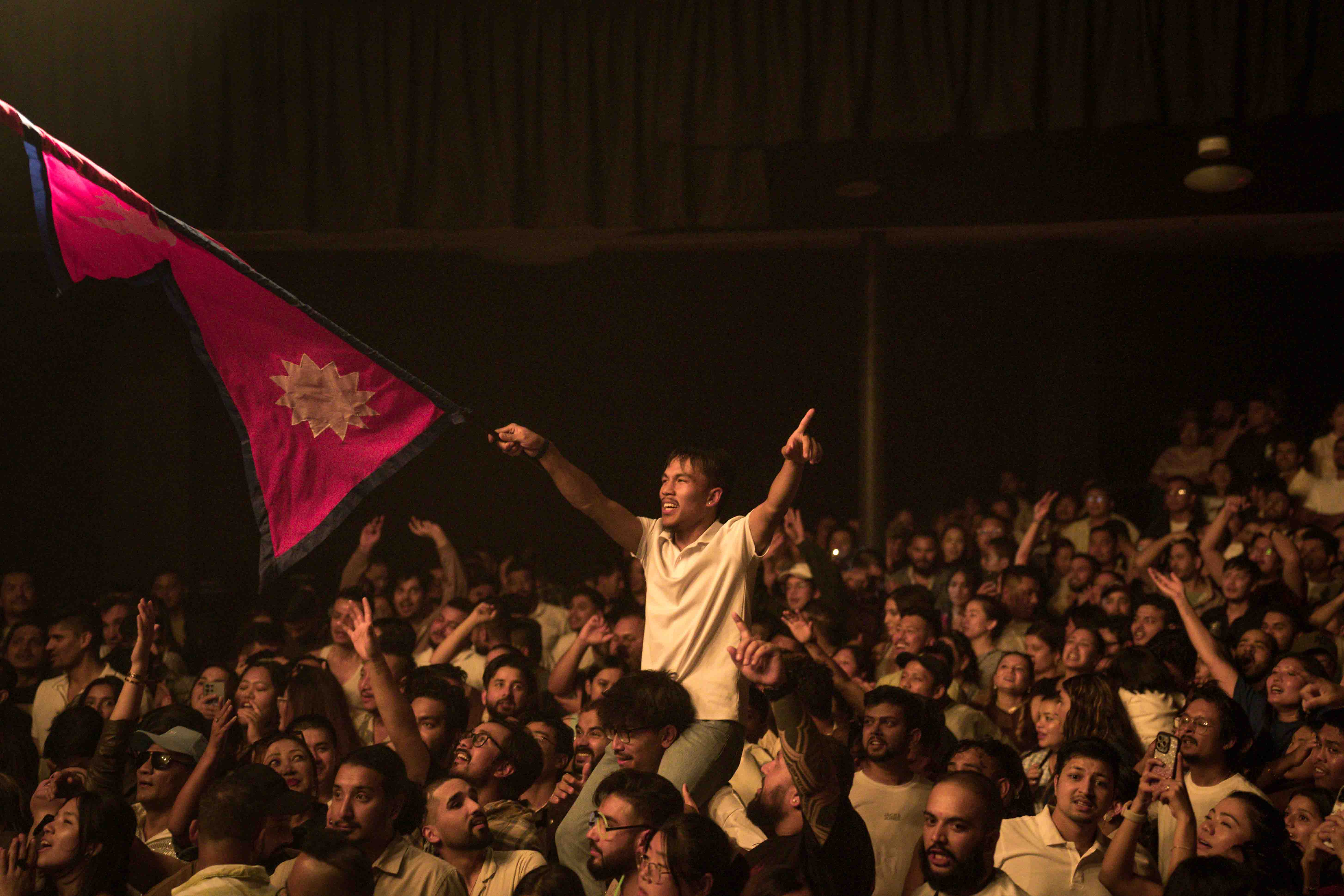 03-An-audience-in-Hobart-of-Australia-raise-Nepali-flag-at-the-Nepathya-concert.-1742356452.jpg